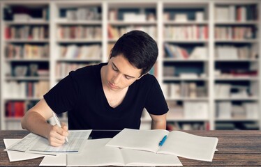 Canvas Print - Happy thinking man student study in library