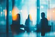 © Антон Сальников - In a blurry bokeh background, we see blurry people in casual clothing in a business office