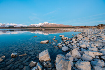 Wall Mural - Calm water and mountain view at Lake Tekapo, New Zealand.