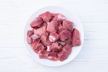 Poster - Beef cubes . Photography of raw cutting meat