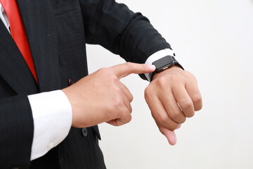 Young asian employee businessman corporate wear smart watch check time isolated on white background studio. Close up