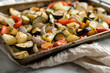 © kossovskiy - Roasted mixed vegetables on a baking tray