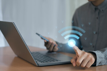 Wall Mural - use business laptop with wifi icon, business communication social network concept.