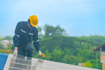 engineer man inspects construction of solar cell panel or photovoltaic cell by electronic device. Industrial Renewable energy of green power. factory worker working on tower roof.