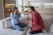 © DimaBerlin - Irritated angry woman man try to convey position, prove rightness, talk in raised voice. Unhappy girl clutching head hurting aching from screaming, guy desperately tries to get through to wife.