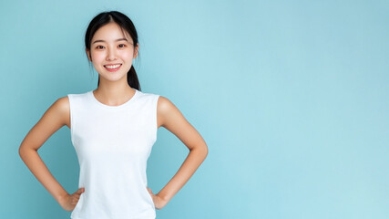 Wall Mural - Chinese woman smile hands on hips wearing white t-shirt isolated on gray