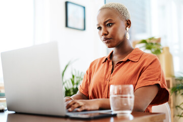 Poster - Typing, online and black woman with laptop, office and thinking of ideas and copywriting. Writer, working and creative for website on desk, seriously and confident in company and reading of person