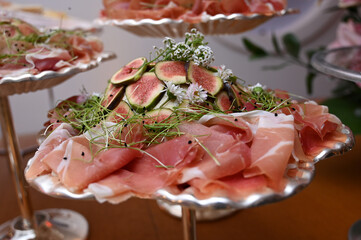 ham and cheese, table setting at a wedding reception, table setting at a restaurant, table setting, table with food, parma ham with fresh figs, buffet