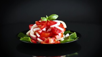 Wall Mural - salad of fresh red tomatoes with onions