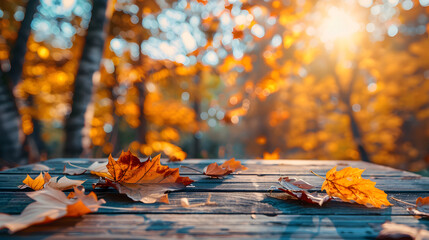 Wall Mural - Autumn background with a wood table and fall leaves on a blurred nature forest background.Autumn concept. fall background. copy space 