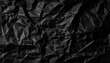 © Arthur - Textured Black Wrinkled Paper. Close-Up of Crumpled Black Fabric Material with Intricate Fold Patterns and Subtle Light Reflections
