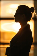 Canvas Print - Professional woman in silhouette against a bright background.