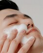 © Steveandfriend - Beauty and cleanser Man washing face with a gentle cleanser, focusing on habitual skincare