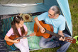 © AD Astra Team/Stocksy - Grandfather teaching his granddaughter to play guitar