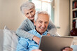 © Chanelle2000/peopleimages.com - Happy old couple, tablet and results on banking app with smile or investment profit review in home. Hug, senior and elderly people reading online retirement savings, insurance growth or news update