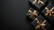 © Nicolai - Black gift boxes with golden ribbon on a black background