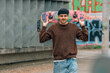 © carballo - young man on the street with skateboard