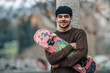 © carballo - young man on the street with skateboard