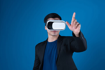 Profile businessman wearing VR headset looking to connect metaverse pointing to choose interesting data isolated blue background futuristic analytics communication tech virtual reality. Contrivance.