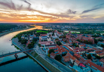 Wall Mural - Kaunas old town, Lithuania. Aerial view of a colorful summer sunset over the city and Nemunas and Neris river confluence