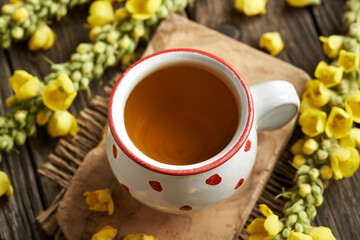 Sticker - Mullein tea in a white and red dotted cup with fresh Verbascum flowers