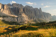 © Anna Tsukanova/Stocksy - Scenic view of sunny meadow in Dolomites at sunset a