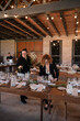 © Malquerida Studio/Stocksy - Preparing and decorating table for celebration