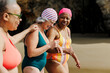 © BONNINSTUDIO/Stocksy - Senior women enjoying time together at the beach