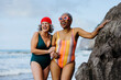 © BONNINSTUDIO/Stocksy - Senior women enjoying beach vacation together