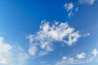 © Kristin Duvall/Stocksy - Clouds and blue sky