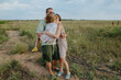 © Anna Artemenko/Stocksy - parents hugging little daughter