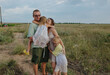 © Anna Artemenko/Stocksy - parents hug their children