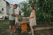 © Anna Artemenko/Stocksy - father cuts watermelon for family