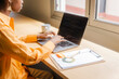 © Nuria Seguí/Stocksy - Businesswoman Working On Laptop In Office Of Tech Startup