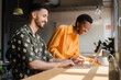 © Nuria Seguí/Stocksy - Businesspeople Working Together With Laptop In Modern Workplace