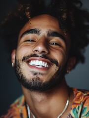 Wall Mural - A smiling man with a beard wearing a casual shirt, suitable for everyday use or as a profile picture