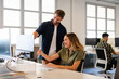 © Nuria Seguí/Stocksy - Teamwork Working Together In A Tech Startup