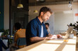© Nuria Seguí/Stocksy - Male Entrepreneur Working On Laptop In Modern Workplace