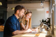 © Nuria Seguí/Stocksy - Businesspeople Working Together With Laptop In Modern Workplace