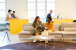 © Nuria Seguí/Stocksy - Female Teamwork Working Together Modern In Office