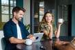© Nuria Seguí/Stocksy - Businesspeople During Coffee Break In Modern Office