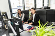 © Luis Velasco/Stocksy - Businesswomen Working At Desk
