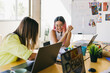 © VICTOR TORRES/Stocksy - Creative team collaborating cheerfully in modern office space