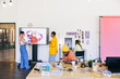 © VICTOR TORRES/Stocksy - Creative team collaborating in a modern office with digital technology