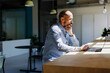 © BONNINSTUDIO/Stocksy - Thoughtful businessman working on laptop in modern office