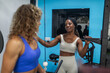 © Lupe Rodríguez/Stocksy - multiracial friends doing sports in the gym