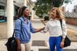 © Lupe Rodríguez/Stocksy - multiracial friends chatting on the street after training in the gym
