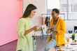 © VICTOR TORRES/Stocksy - Two women enjoying lunch break in stylish work environment