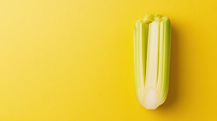 Poster - Single celery stalk on yellow background.