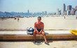 © Lupe Rodríguez/Stocksy - Analog portrait of a man on the beach in Benidorm, Spain in the 90s